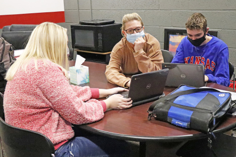 Olivia Lawless (left) and Cole Oswald get a few pointers on scholarship applications from AHS guidance counselor Sheila Hasenkamp.