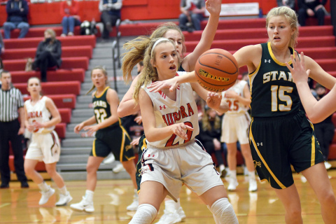 Aurora's Delaney Nachtigal fights for a loose ball on the offensive end during the second half of Aurora's 38-31 win. 
