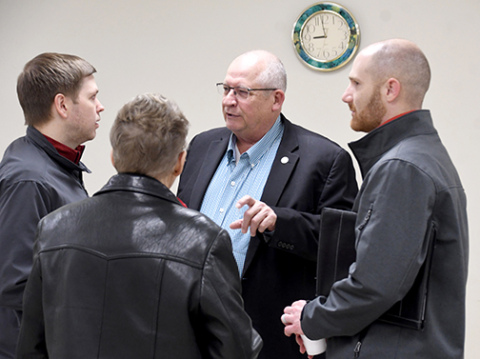 Dist. 34 Sen. Curt Friesen visits with constituents after Friday’s town hall forum in Aurora, including, from left: Jim Ediger, Cyndi Muilenburg and Brock Wyatt.