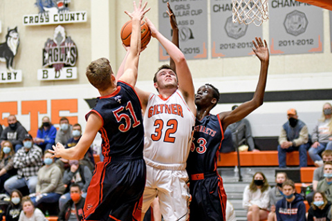 Giltner’s Jacob Smith fights through contact in the paint during a 43-32 loss to Heartland Lutheran Feb. 23. 
