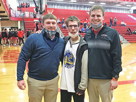 York Dukes coach JT Hamm (left) joined Sammie Weddle and Aurora coach Scott Phillips after the York vs. Aurora varsity matchup last week. They sat down for a quick chat after snapping this picture.