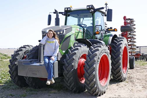 Laura Wilson sits atop this brand-new Fendt tractor, given to her by the company to demo on her YouTube channel, Laura Farms.