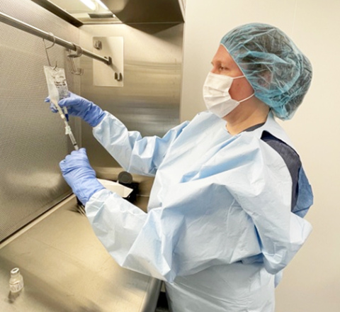A major upgrade to the hospital pharmacy is the focus of fundraising for MCHI’s Stay@Home Gala. Pictured here is MCHI’s Director of Pharmacy Nicole Dvorak, demonstrating the use of one of two new Primary Engineering Control (PEC) units, also known as “IV hoods.”  The PECs purchased include a biological safety cabinet for hazardous preparations, such as chemotherapy treatments, and a laminar airflow workbench (pictured) for the preparation of non-hazardous drugs such as IV antibiotics...