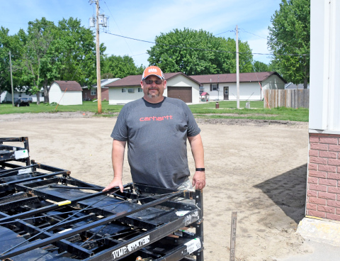 News-Register/Kurt Johnson Scott Snider stands on the Snider’s Outdoor Power property on Highway 14. The existing structure is to the right, and behind him is a leveled site where a 63-by-35 foot addition will soon be built.