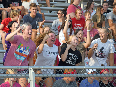 From left, Aurora juniors Lexi Jones, Kasey Schuster, Eva Fahrnbruch and Madie Stevenson go through a cheer during the pep rally Tuesday night. 