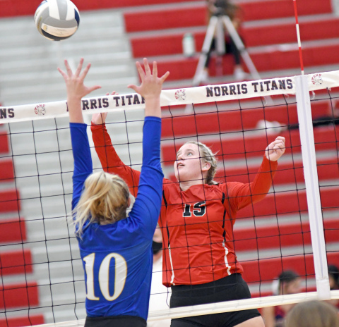 Lexi Jones records a kill during Aurora's loss to Wahoo Thursday night. 