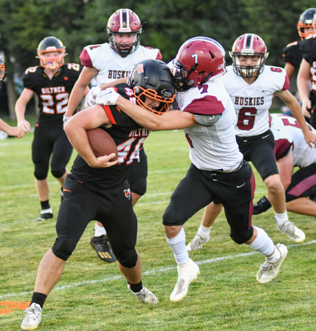 Giltner's Dakon Wilson battles through contact in the Hornets' 52-14 loss to Heartland Friday