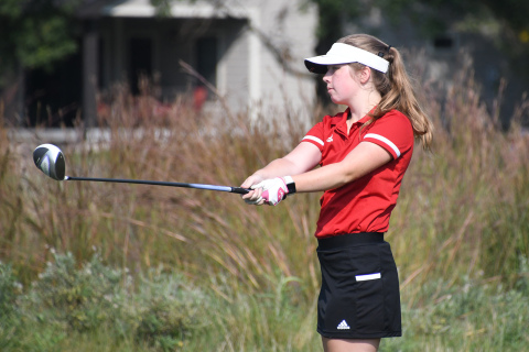Aurora senior Maddie Krejci watches her drive on the par-4 sixth hole Saturday.
