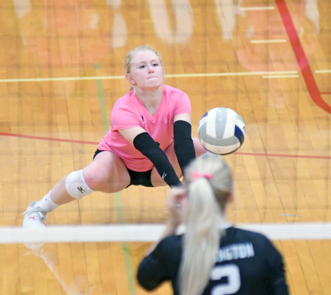 Kirsten Jensen receives a serve during Aurora's five-set loss to Lexington. 