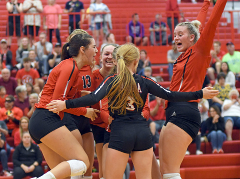 Aurora celebrates a point during its five-set win over York Thursday. 