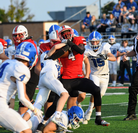 Mack Owens battles up the middle during Aurora's 55-44 loss to Bennington Friday. 