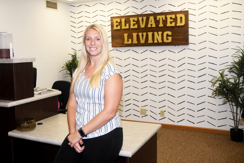 Devon Rasmussen had help from family members in remodeling the office space, and creating a new sign, for Elevated Living Chiropractic.