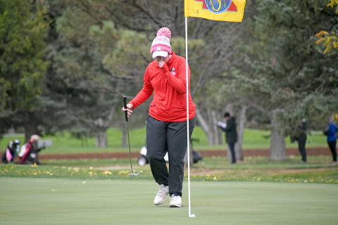 Aurora’s Grace Ziegler watches her putt fall into the cup on the par-3 seventh hole during day two action of the Class B state golf tournament at Scottsbluff Country Club. 