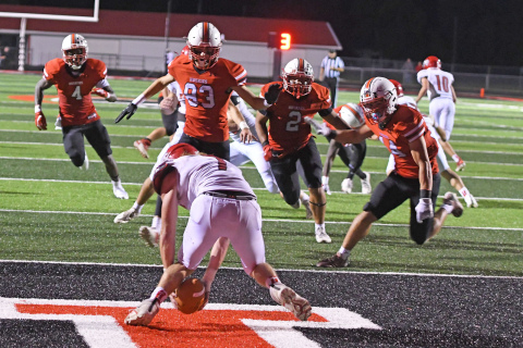 From left, Mack Owens, Caden Carlson, Carlos Collazo and Bryce Barger converge on McCook punter, ultimately tackling him for a safety.