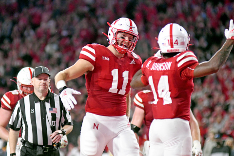 Nebraska co-captain Austin Allen is all smiles for teammate running back Ramir Johnson after his touchdown run in the second quarter of Nebraska’s 56-7 drubbing of Northwestern Saturday night. 