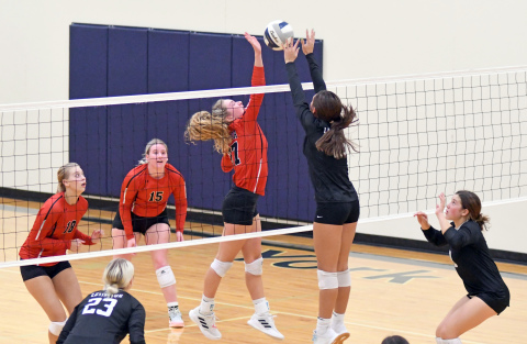 Kasey Schuster battles at the net during Aurora's two-set win over Lexington Thursday. 