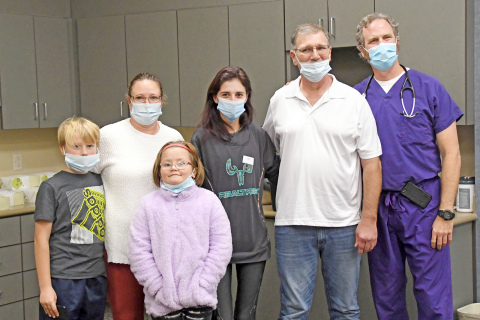 Rick Hock (second from right) celebrated with his family and caretakers during a Nov. 9 event. Those pictured include from left: Kayden Ehlers, Chris Hock, Serenity Halsey, Alicia Hock, Rick, Dr. Erich Fruehling. 