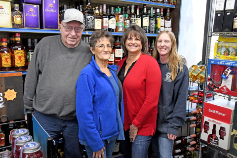 Larry and Theresa Naeve, left, sold T&L Convenience & Liquor to their daughter Lori Meyer and her husband Brian, (not pictured) who are now co-owners and partners with store manager Missy Kliewer, pictured at right.