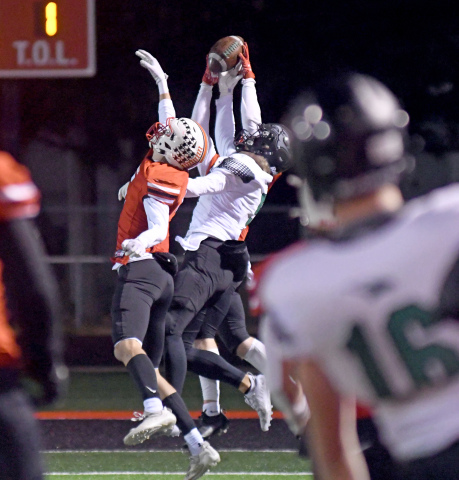 Tate Nachtigal and Britton Kemling break up a late pass as the Huskies hang on to defeat Omaha Skutt 21-17. 