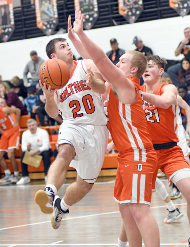 Giltner’s Dakon Wilson tries to make a play in the lane during the Hornets’ 70-27 loss to Osceola Friday night at home. 