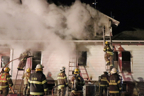 Local fire crews worked through bitter cold temps to help tame a Marquette house fire in the morning hours of Jan. 21.