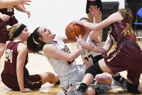 Hampton’s Neveah Lukassen battles for a loose ball against East Butler.