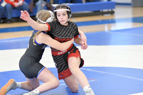 Natalie Bisbee fights out of a hold during Aurora’s 36-24 win over Columbus Lakeview Thursday. 