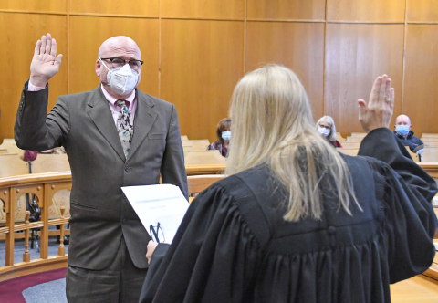 Doug Dexter is sworn in Thursday as Hamilton County’s new deputy county attorney by Dist. Judge Rachel Daugherty.
