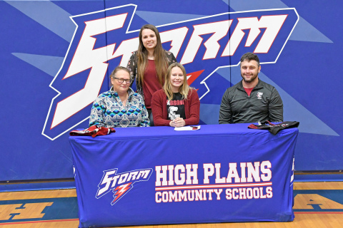 Hannah Hodgman signed on to join the Hastings College cheer team alongside her mother, Michelle Aase, HPC cheer coach Jayden Urkoski and Hastings College coach Jordan Smith. 