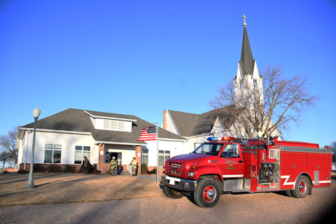 Hamtpon firefighters battled freezing temperatures early Thursday morning while finding the cause of smoke in the basement of the fellowship hall next to Zion Lutheran Church north of Hampton.