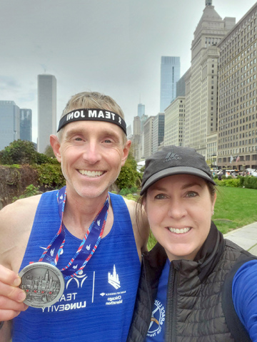 Chad and Joni Oswald snap a quick photo after Chad finished the Chicago Marathon last year. 