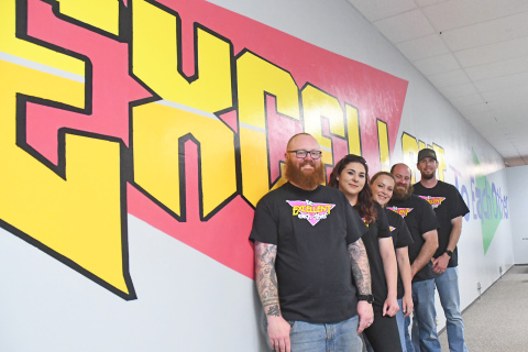 From left to right: Paul Johnson, Jen James, Mallory Johnson, Alex Hageman and Nick Lewis are the “core” team of volunteers standing next to the mural reading “Be Excellent to Each Other.” 