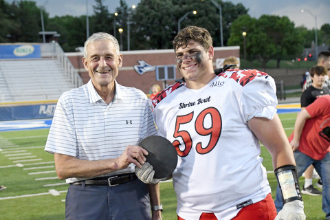 A special moment for two Aurora alumni followed Saturday’s Shrine Bowl game as Tom Kropp, one of the most decorated Nebraska high school athletes in state history took time to meet with Gage Griffith, the man who took down Kropp’s Aurora discus school record earlier this spring. 
