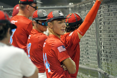 Aurora Pinnacle Bank Seniors in the dugout, including Wyatt James (14) put on their rally hats in the 7th inning of a 7-3 loss to Shelton/Gibbon at home last week. Aurora rallied for three runs in the seventh, but not enough to complete the comeback.