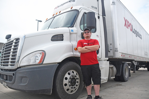Trucker Trey Nowak stands in front of his XPO Logistics 18-wheeler before he heads out for a delivery. XPO Logistics’ less than trailer load (LTL) shipping provides flexibilty in completing orders.