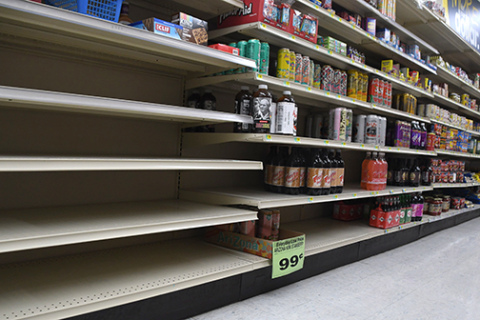 A row of shelves at the Aurora Mall. While most shelves are filled there is still up to a third of items ordered that do not reach the grocery store.