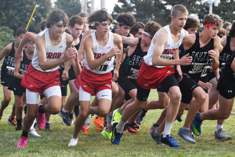 Aurora runners are off at the gun in the GINW 5K Gold Division race. Coach Tony Sigler stated that the team is on better footing now compared to last year.