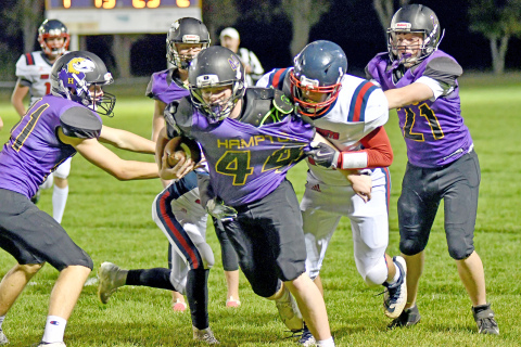 Bryce Joseph drags two defenders along on one of his seven carries for 50 yards.