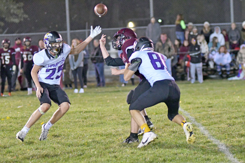 Kash Majerus (81) comes up with a strip sack that Wyatt Dose (25) picked up and took to the house in Hampton’s 64-32 win over St. Edward Friday. 