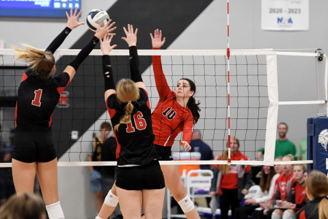Aurora senior Aleah Vinkenberg fires a shot around the block of David City’s Avery Couch (1) and Grace Eickmeier (16).