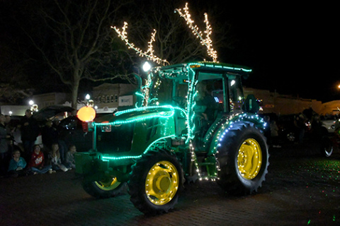 This is one of many entries in Friday's lighted tractor parade.