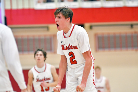 Booker Scheierman puts a jolt into his home bench after a made three-pointer cut the Beatrice lead to one possession in the second half of Aurora’s 39-30 overtime loss at home Saturday. 