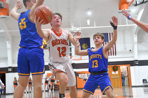Giltner’s Cooper Reeson splits the defense on a drive during a 49-27 loss to Nebraska Lutheran Dec. 13. 