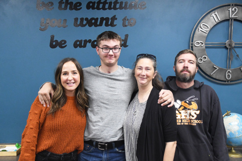 Gathered together, from left, special education teacher Kirsten Kreutz, Jacob, Becky and Kevin Wiles reflected on the Wiles’ journey since Jacob’s accident. More than a year after the accident, they shared the story of Jacob’s journey of reclaiming skills having sustained a traumatic brain injury.