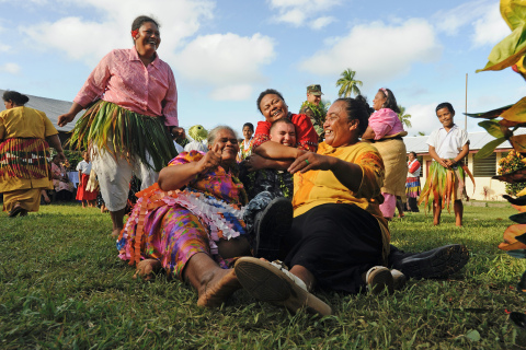 Musician 3rd Class Anton du Preez gets a group hug from the women of the Kingdom of Tonga as part of his 2011 Pacific Partnership tour. The Pacific Partnership is multinational tour that prepares Pacific-bordering nations for national disasters and provides medical assistance since 2004.