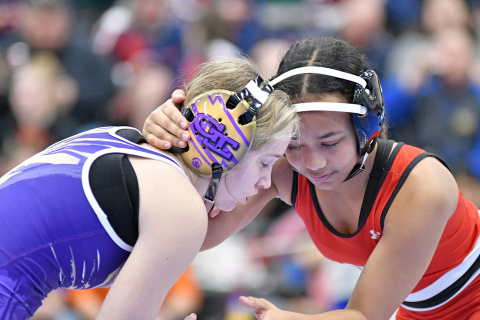 Aurora’s Aubrie Beed battles Grand Island’s Addisyn Gates during early round action at the Norm Manstedt girls Invite Thursday. 