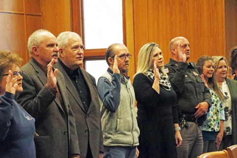 Among those being sworn in Friday were, from left: Pat Sandberg (assessor), Francis McDonald (commissioner), Rich Nelson (commissioner), Adam Goertzen (surveyor), Nicole SaBell (commissioner), Jeromy McCoy (sheriff), Christy Wert (deputy treasurer) and Jody Griffith (treasurer).