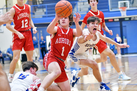 Aurora’s Aleah Vinkenberg guards Seward’s Eden Schulz all the way to the floor in the second half of the Jays’ 52-36 win over the Huskies Friday night. 