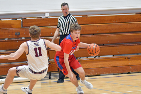 HPC’s Chase Owens dribbles past BDS’s Easton Weber during the Storm’s 53-40 loss to the Eagles Saturday. 