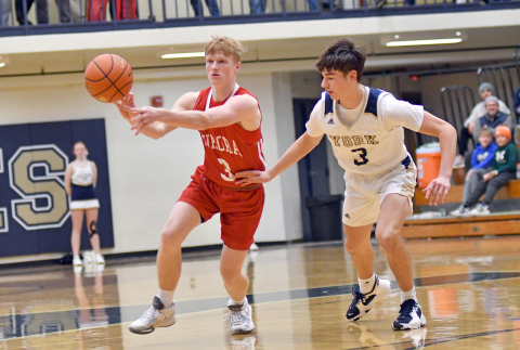 Drew Knust circles the offense around the horn during Aurora’s 60-38 loss to York in the Central Conference semifinals Friday night played in the Duke Dome. 